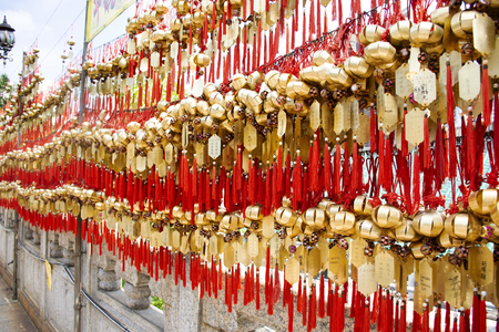 Chinese people and foreign travelers tied holy bell on wall for respect praying at Wong Tai Sin Temple at Kowloon island on September 9, 2018 in Hong Kong, Chinaのeditorial素材