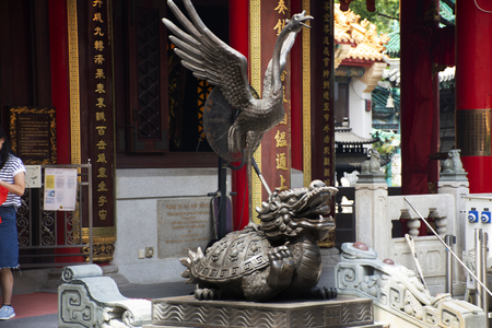 Dragon tortoise and Vermilion Bird statues four celestial animals of Chinese mythology guardian at Wong Tai Sin Temple on September 9, 2018 in Hong Kong, Chinaのeditorial素材