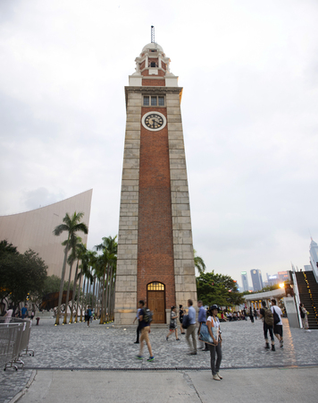 Chinese and foreigners people travel visit at square of Former Kowloon - Canton Railway Clock Tower in Tsim Sha Tsui city on September 5, 2018 in Hong Kong, Chinaのeditorial素材