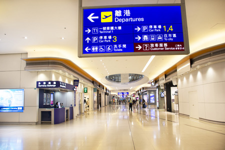 Chinese and foreigner travelers walking in terminal 2 of Hong Kong International Airport or Chek Lap Kok Airport on September 10, 2018 in Hong Kong, Mainland Chinaのeditorial素材