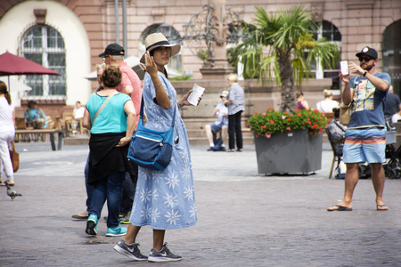 Travelers thai woman walking travel and visit shopping in heidelberger market or marktplatz at Heidelberg city on August 25, 2017 in Baden-Wurttemberg, Germanyのeditorial素材