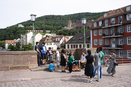 Music band of German people playing music for show Germany people and foreigner travelers on Karl Theodor Bridge or Old Bridge on August 25, 2016 in Heidelberg, Germanyのeditorial素材
