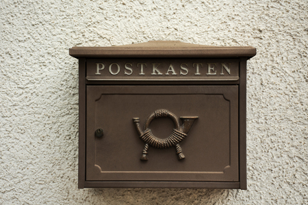 Classic retro letter box on thw wall at home of german people at Sandhausen district and village in Heidelberg, Germanyの写真素材