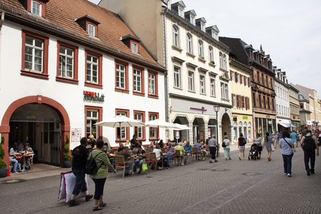 German people and foreign travelers walking visit and sit eat and drink at heidelberger old town market square or marktplatz on August 25, 2017 in Heidelberg, Germanyのeditorial素材