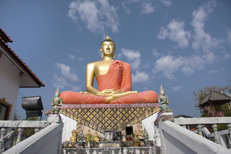 Stupa chedi and buddha statue images in Wat Phrachao Thanchai and Phra That San Kwang temple for thai people and foreigners travelers visit and respect praying at Chiangrai city in Chiang Rai, Thailandの写真素材