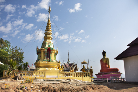 Stupa chedi and buddha statue images in Wat Phrachao Thanchai and Phra That San Kwang temple for thai people and foreigners travelers visit and respect praying at Chiangrai city in Chiang Rai, Thailandの写真素材