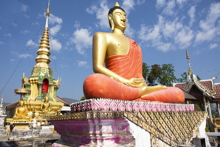 Stupa chedi and buddha statue images in Wat Phrachao Thanchai and Phra That San Kwang temple for thai people and foreigners travelers visit and respect praying at Chiangrai city in Chiang Rai, Thailandの写真素材