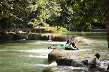 Thai people and travelers foreigner travel relax and play swimming in Namtok Chet Sao Noi small waterfall at National Park on November 13, 2018 in Saraburi, Thailandのeditorial素材