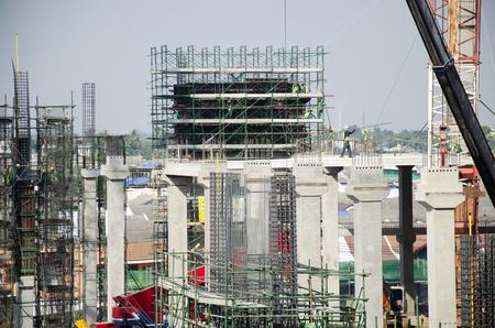 Asian people and thai workers with heavy machinery working builder new building at construction site...