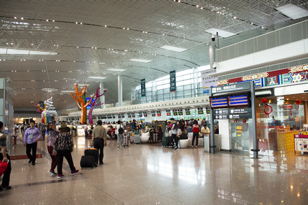 Chinese people and foreign travelers walking visit and wait checkin at Jieyang Chaoshan International Airport at Shantou or Swatow city on May 10, 2018 in Guangdong, Chinaのeditorial素材