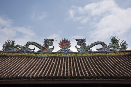 Decoration design and sculpture and carving colorful art roof of chinese shrine at Kaiyuan Temple at Teochew cityの写真素材