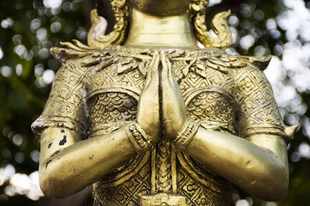 Angel brass statue in garden of Phra That Nadoon Chedi or Na Dun Pagoda for thai people travel visited and respect praying at Mahasarakham cityの写真素材