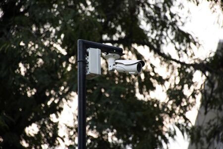 Closed Circuit Camera Television or CCTV in public space area of garden park at Delhi city in New Delhi, Indiaの写真素材