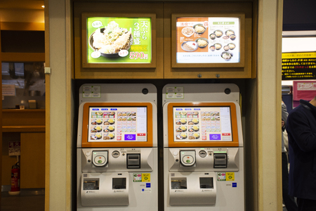 Tokyo, Japan - March 29, 2019 : Vending machine at front of udon and ramen shop for Japanese people and foreign travelers buy gourmet food and soft drink at Ariake Stationのeditorial素材