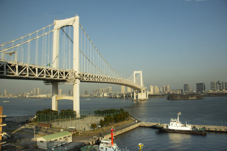 Tokyo, Japan - March 29, 2019 : View landscape and cityscape Odaiba downtown and rainbow bridge from MRT train Rinkai Line go to tokyo big sight in Ariake townのeditorial素材