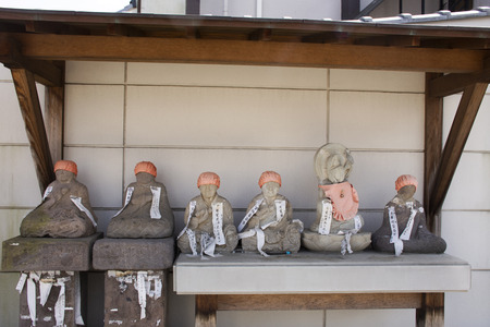 Tokyo, Japan - March 31, 2019 : Statue buddha and monk statues in small shrine in Naritasan Omote Sando or Narita old town for people visit and praying at Chiba Prefectureのeditorial素材