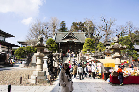 Tokyo, Japan - March 31, 2019 :  Travelers thai women travel visit and portrait for take photo with building of Naritasan Shinshoji Temple of Narita city at Chiba Prefecture on March 31, 2019 in Tokyo, Japanのeditorial素材