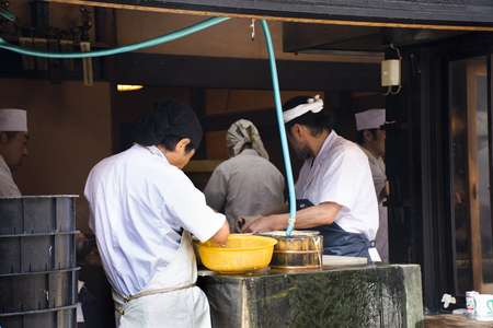 Tokyo, Japan - March 31, 2019 : Japanese people kill and fillet eel fish for show and cooking kabayaki or eel grill with sweet sauce in Narita old town at Chiba Prefecture on March 31, 2019 in Tokyo, Japanのeditorial素材