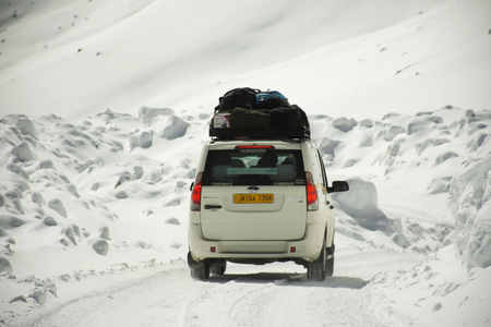 JAMMU KASHMIR, INDIA - MARCH 21 : Indian people driving van on Khardung La road pass go to Nubra Valley in Hundar city while winter season at Leh Ladakh on March 21, 2019 in Jammu and Kashmir, Indiaのeditorial素材