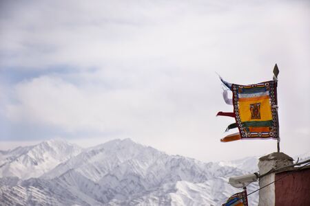 Prayer flag for blessing at viewpoint of Shanti Stupa on a hilltop in Chanspa while winter season at Leh Ladakh in Jammu and Kashmir, Indiaの写真素材