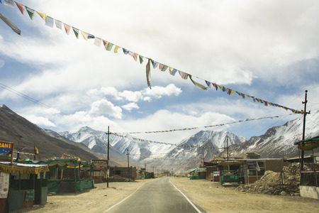 JAMMU KASHMIR, INDIA - MARCH 20 : Tibetan and indian people walking beside road of Tsati village on khardung la pass while winter season at Leh Ladakh on March 21, 2019 in Jammu and Kashmir, Indiaのeditorial素材