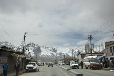 JAMMU KASHMIR, INDIA - MARCH 20 : Traffic road and Indian people drive car and riding motorcycle and walking on Srinagar Leh Ladakh highway at Leh Ladakh on March 21, 2019 in Jammu and Kashmir, Indiaのeditorial素材