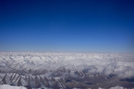 Aerial view landscape with himalaya range mountains from airplane flying from New delhi go to Kushokの写真素材