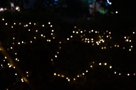 Motion movement of colorful Bokeh of led lingthing in garden of street market fair at Nakhon Ratchasima, Thailand.の写真素材