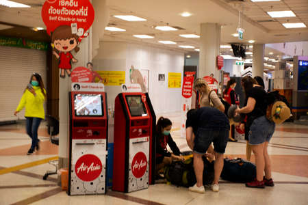 CHIANG MAI, THAILAND - FEBRUARY 28 : Inside of Chiangmai airport and people walking check in while...