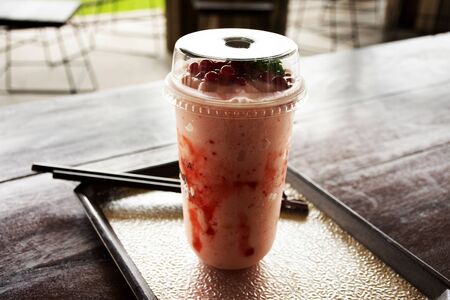 Strawberry yogurt frappe in plastic cup at cafe coffee shop in Ayutthaya, Thailandの写真素材