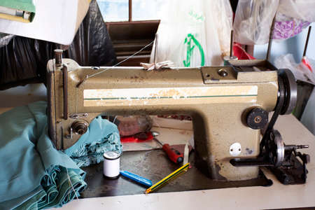 PHATTHALUNG, THAILAND - AUGUST 20 : Classic vintage antique retro sewing fabric machine for thai people work at home and repair clothes at house countryside on August 20, 2019 in Phatthalung, Thailandのeditorial素材