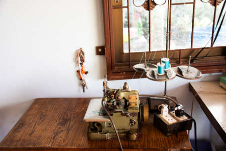 PHATTHALUNG, THAILAND - AUGUST 20 : Classic vintage antique retro overlock and safety stitch machine sewing for thai people work at home in countryside on August 20, 2019 in Phatthalung, Thailandのeditorial素材