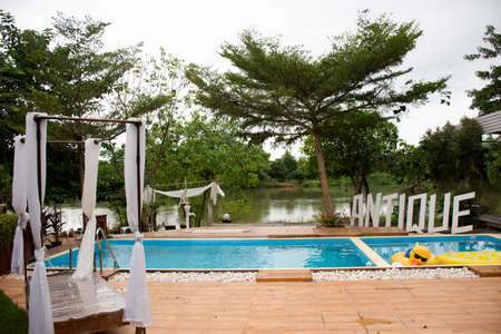 RATCHABURI, THAILAND - SEPTEMBER 23 : View landscape garden and lawn with swimming pools for people...