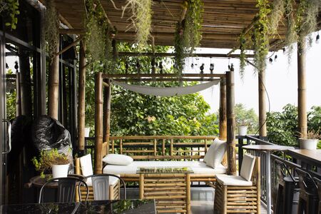 Exterior design and decoration furniture at terrace outdoor of cafe coffee shop for thai people and foreign travelers eat and drinks at Mukdahan, Thailandの写真素材
