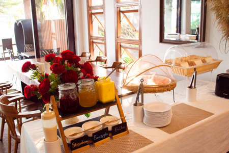 MUKDAHAN, THAILAND - OCTOBER 2 : Buffet breakfast food in dining room in morning time for travelers and guest people eat and drinks at resort hotel on October 2, 2019 in Mukdahan, Thailandのeditorial素材