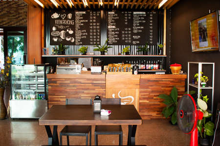 MUKDAHAN, THAILAND - OCTOBER 2 : Interior decoration furniture of cafe coffee shop with staff barista brew make coffee serve customer  at luxury coffee shop on October 2, 2019 in Mukdahan, Thailandのeditorial素材