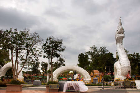 MUKDAHAN, THAILAND - NOVEMBER 12 : Big white naka statue for thai people travelers travel visit and respect praying at Kaeng kabao canyon at maekong riverside on October 12, 2019 in Mukdahan, Thailandのeditorial素材