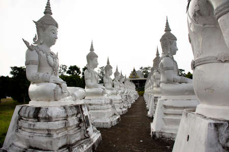 SAKON NAKHON, THAILAND - OCTOBER 2 : Buddha statue of Wat Phrabuddhabat Nam Thip temple for thai people travelers travel visit respect praying at Phu Phan on October 2, 2019 in Sakon Nakhon, Thailandのeditorial素材