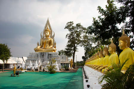 SAKON NAKHON, THAILAND - OCTOBER 2 : Buddha statue of Wat Phrabuddhabat Nam Thip temple for thai people travelers travel visit respect praying at Phu Phan on October 2, 2019 in Sakon Nakhon, Thailandのeditorial素材