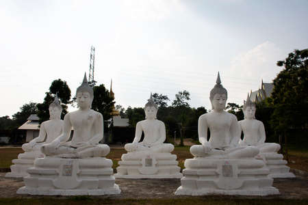 SAKON NAKHON, THAILAND - OCTOBER 2 : Buddha statue of Wat Phrabuddhabat Nam Thip temple for thai people travelers travel visit respect praying at Phu Phan on October 2, 2019 in Sakon Nakhon, Thailandのeditorial素材