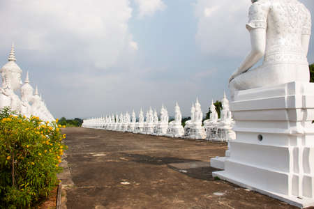 SAKON NAKHON, THAILAND - OCTOBER 2 : Buddha statue of Wat Phra Buddha Bat Nam Thip temple for thai people travelers travel visit respect praying at Phu Phan on October 2, 2019 in Sakon Nakhon, Thailandのeditorial素材