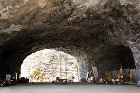 SUPHAN BURI, THAILAND - OCTOBER 28 : Travelers thai people travel visit and respect praying buddha angel god in cave of Wat Khao Tham Thiam at U Thong city on October 28, 2019 in Suphanburi, Thailandのeditorial素材