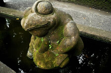 Art sculpture and carved antique deity angel god of hindu statue balinese style in Mandala Suci Wenara Wana or Ubud Sacred Monkey Forest Sanctuary at Ubud city in Bali, Indonesiaの写真素材