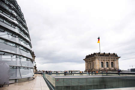 German people and foreign travelers travel visit on roof top of Dem deutschen Volke or Reichstag National Imperial Diet Building at Berlin city in Berlin, Germanyのeditorial素材