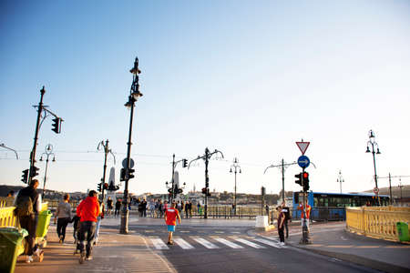 BUDAPEST, HUNGARY - SEPTEMBER 23 : Traffic road with train tram and Hungarian passengers and foreign travelers walking footpath beside Elizabeth Bridge road on September 23, 2019 in Budapest, Hungaryのeditorial素材