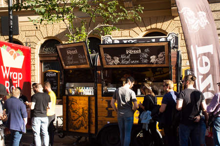 BUDAPEST, HUNGARY - SEPTEMBER 21 : Hungarians and foreign traveler walking visit and eat drinks in street food market fair carnival at Andrassy Avenue road on September 21, 2019 in Budapest, Hungaryのeditorial素材