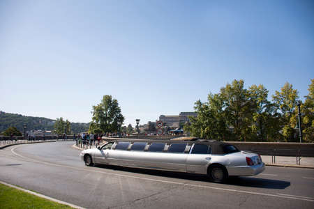 BUDAPEST, HUNGARY - SEPTEMBER 22 : Hungarians driver driving classic retro vintage antique limousine on road for bring travelers passenger tour at buda city on September 22, 2019 in Budapest, Hungaryのeditorial素材