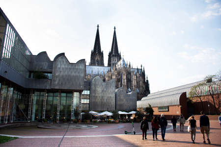 View landscape modern buildings and German people and foreign travelers walking go to Cologne Cathedral or Hohe Domkirche St. Petrus und Maria or Kolner Dom on September 11, 2019 in Cologne, Germanyのeditorial素材