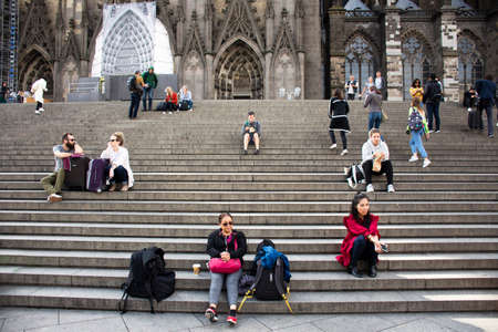 German people and foreign travelers travel visit and respect praying god at Cologne Cathedral or Hohe Domkirche St. Petrus und Maria or Kolner Dom on September 11, 2017 in Cologne, Germanyのeditorial素材