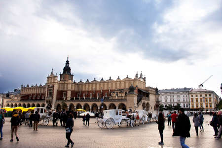Polish wait and ride horse drawn carriages for Pole people and foreigner travelers use service tour Krakow Old Town in Main Market Square at Stare Miasto on September 20, 2019 in Lesser, Polandのeditorial素材